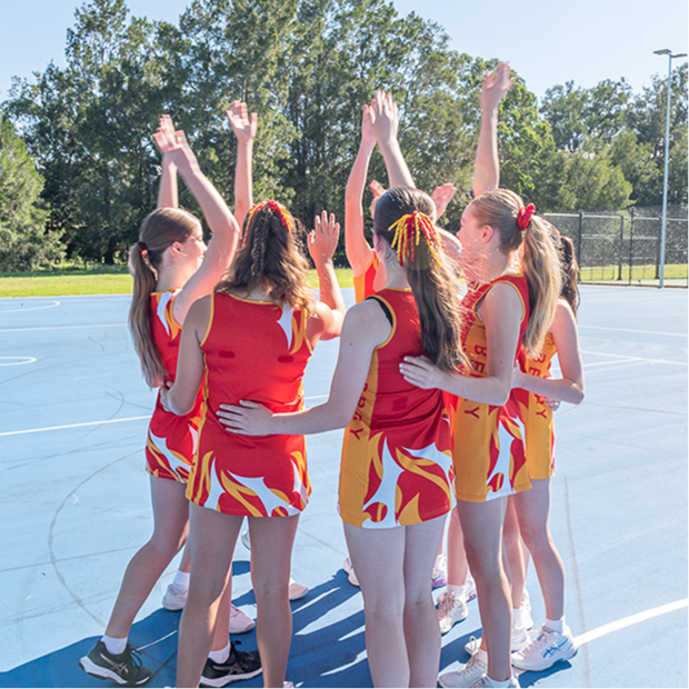 Berry players in a team huddle.